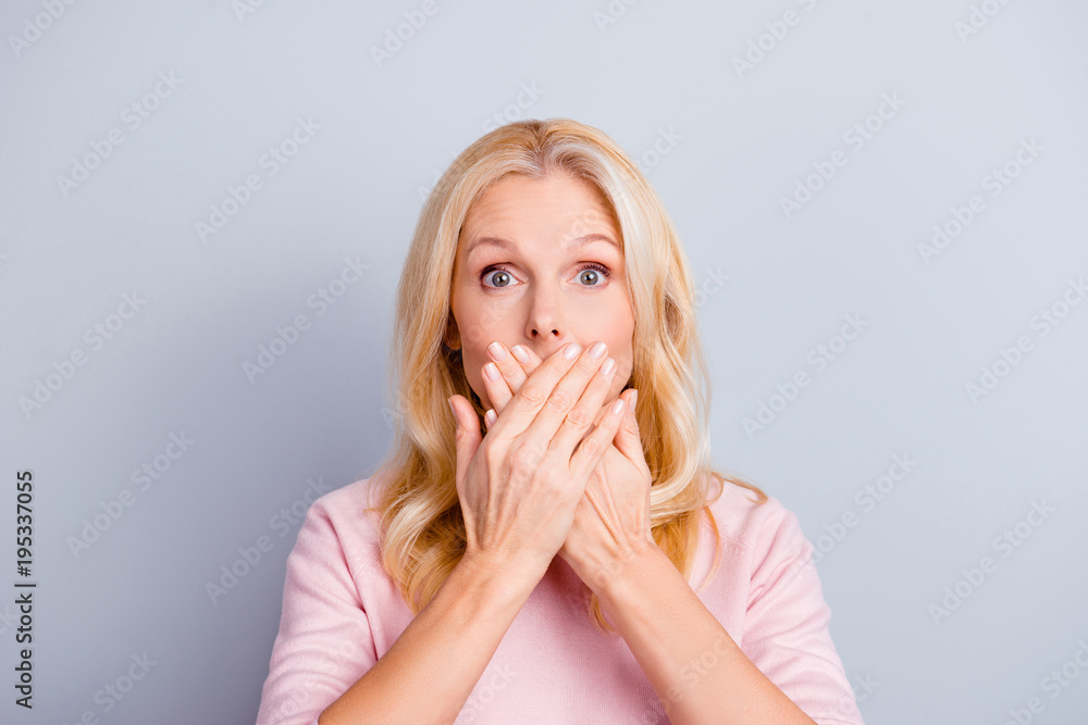 Close up portrait of funky curious cunning beautiful talkative gentle wondered astonished amazed lovely journalist grandmother grandma granny closes covers mouth isolated on gray background Close up portrait of funky curious cunning beautiful talkative gentle wondered astonished amazed lovely journalist grandmother grandma granny closes covers mouth isolated on gray background