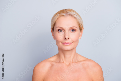 Portrait of pretty  attractive  charming  blonde  shirtless  nude woman with perfect skin  isolated on grey background  looking at camera  after peeling  lotion  mask  perfection  hydration concept