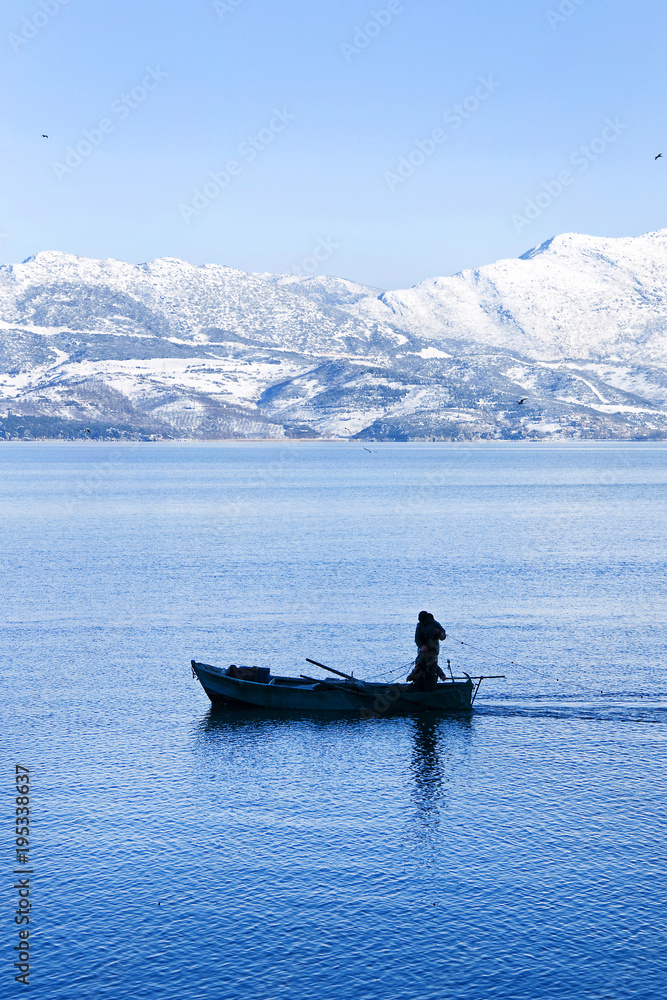 Fisherman boat on Lake Egirdir from Isparta City in Turkey. The lake is a second biggest freshwater lake in Mediterranean coast of Turkey