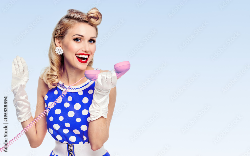smiling woman with phone, dressed in pin-up style smiling woman with phone, dressed in pin-up style
