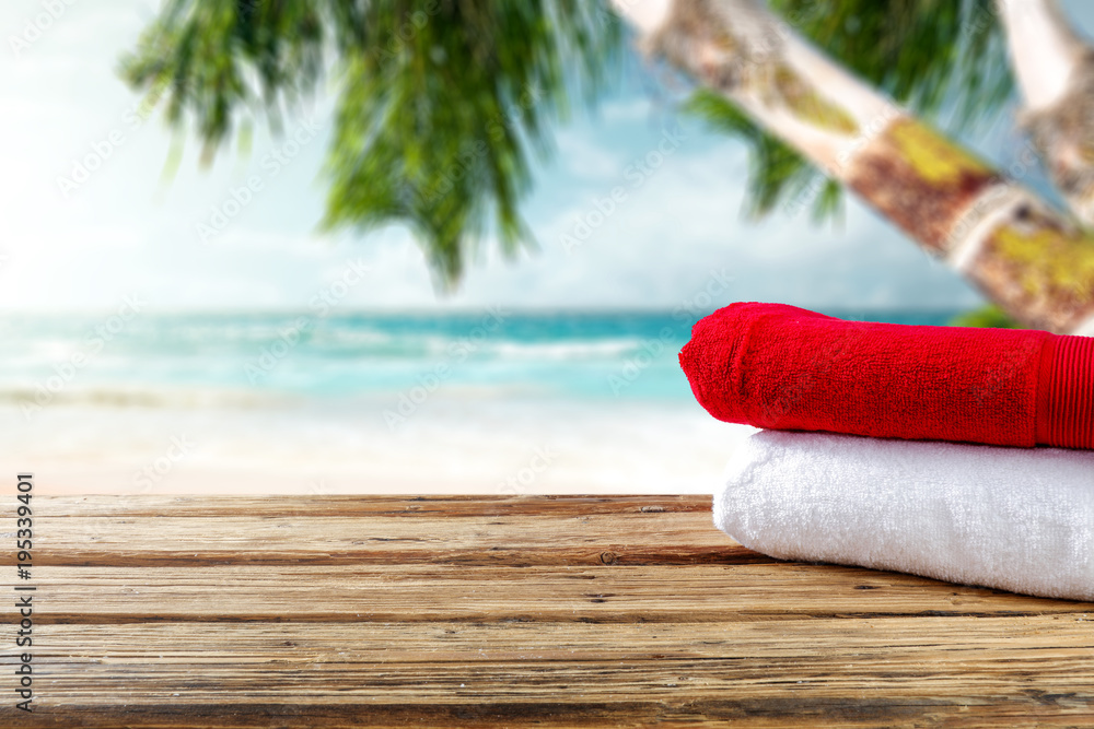 Summer tools on wooden brown desk and beach landscape 