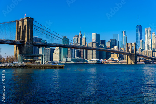Lower Manhattan Downtown skyline panorama from Brooklyn Bridge Park riverbank, New York City, USA