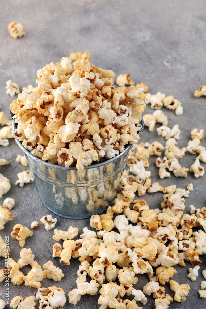 Salt popcorn or sweet popcorn on old grey background. Salt popcorn or sweet popcorn on old grey background.