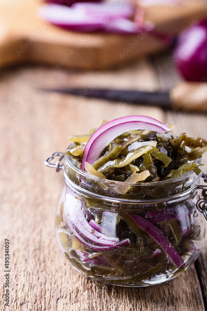 Sea kale salad with red onion in glass jar Sea kale salad with red onion in glass jar