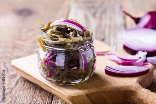 Sea kale salad with red onion in glass jar