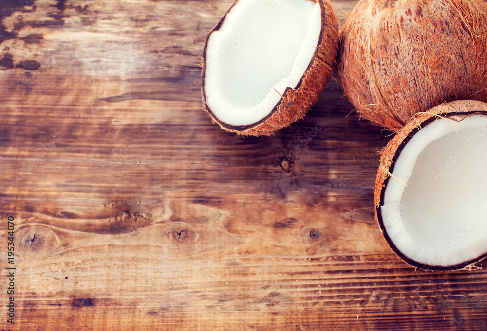 coconut and coconut milk on wooden table coconut and coconut milk on wooden table