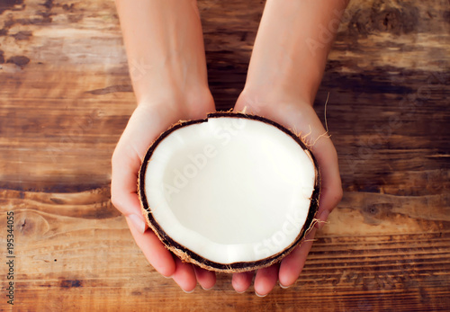 coconut and coconut milk on wooden table