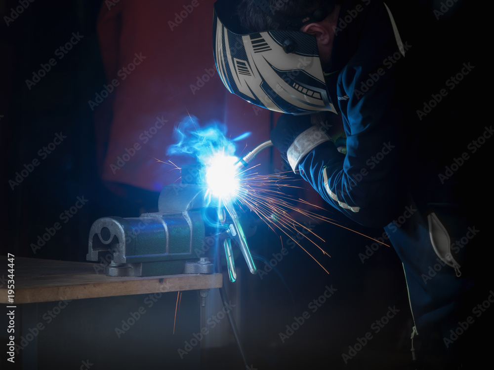 A man who welds something A man who welds something