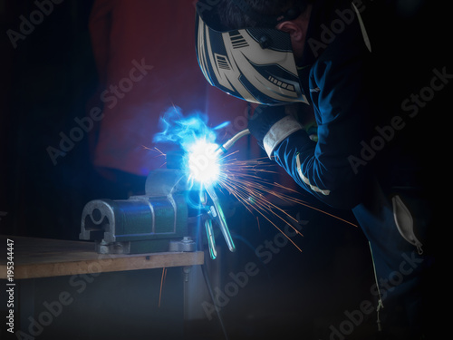 A man who welds something