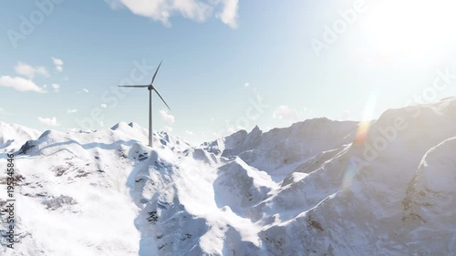 Wind generator in snowy mountains photo