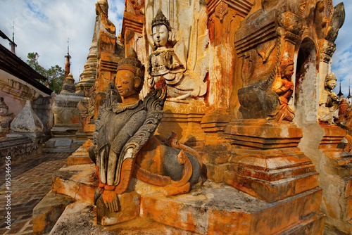 Shan. Myanmar. 11/29/2016. A favorite place for tourist excursions - Takhaung Mwetaw pagoda, where more than 200 stupas, with a unique bas-reliefs. Ragada located on the shores of Inle lake. photo