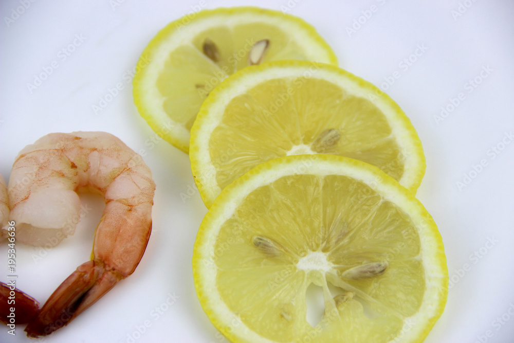 seafood. shrimp on a plate with lemon. seafood. shrimp on a plate with lemon.