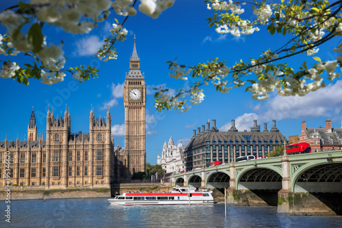 Big Ben with boat during spring time in London, England, UK