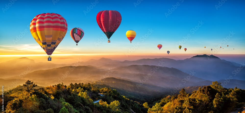 Colorful hot air balloons flying over mountain at Dot Inthanon in Chiang Mai, Thailand.. - obrazy, fototapety, plakaty 