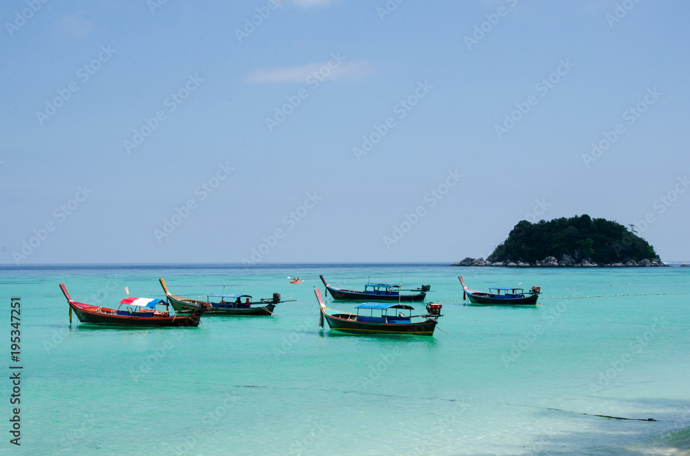 Long tail boat on tropical beach, Lipe, Thailand Long tail boat on tropical beach, Lipe, Thailand
