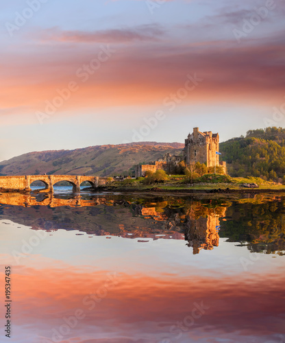 The Eilean Donan Castle with colorful sunset  Highlands of Scotland