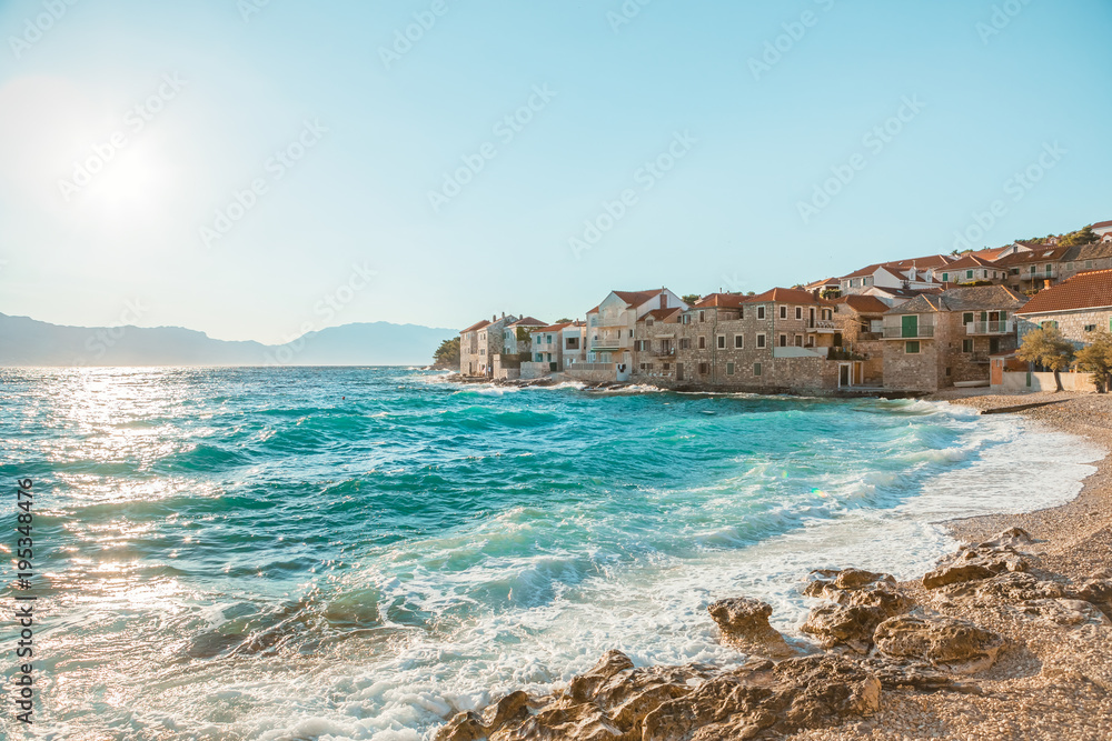 Panoramic view on a beautiful beach of a small town Postira - Croatia, island Brac