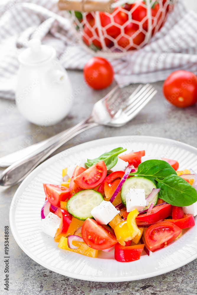 Tomato salad with fresh bell pepper, red onion and feta cheese. Healthy eating Tomato salad with fresh bell pepper, red onion and feta cheese. Healthy eating