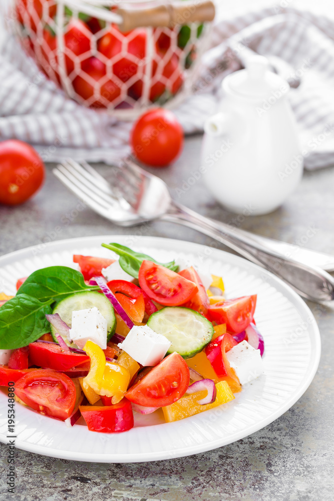 Tomato salad with fresh bell pepper, red onion and feta cheese. Healthy eating Tomato salad with fresh bell pepper, red onion and feta cheese. Healthy eating
