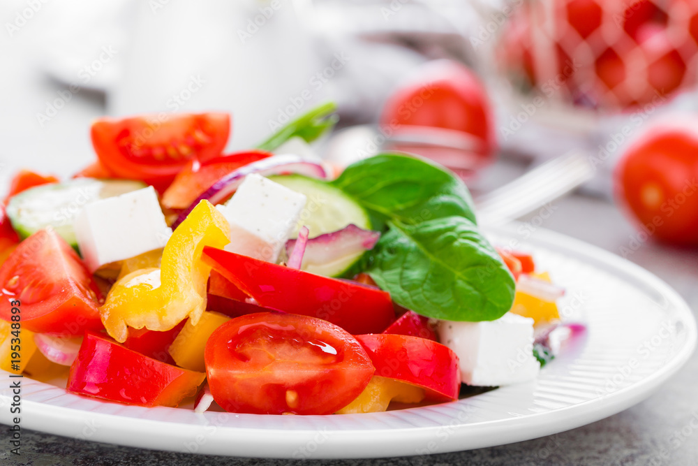 Tomato salad with fresh bell pepper, red onion and feta cheese. Healthy eating Tomato salad with fresh bell pepper, red onion and feta cheese. Healthy eating