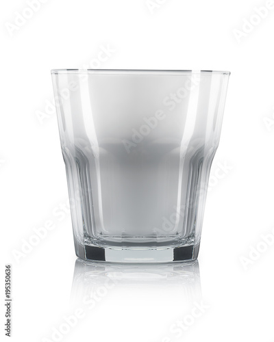 Empty old fashioned cocktail glass on a white background.