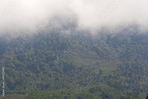 Clouds over mountain in Guatemala, sign of deforestation in central america.