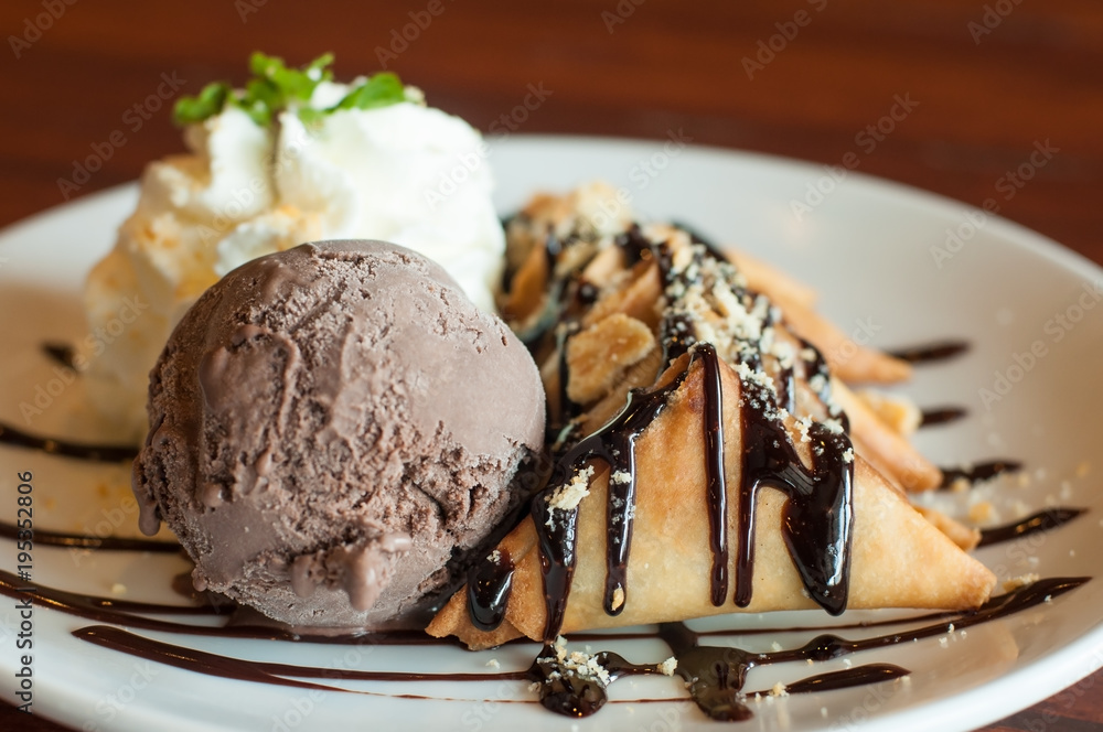 Chocolate ice-cream and soft cream with crispy snack set on white plate and  topping with chocolate sauce, food dessert stylish. Stock Photo | Adobe  Stock