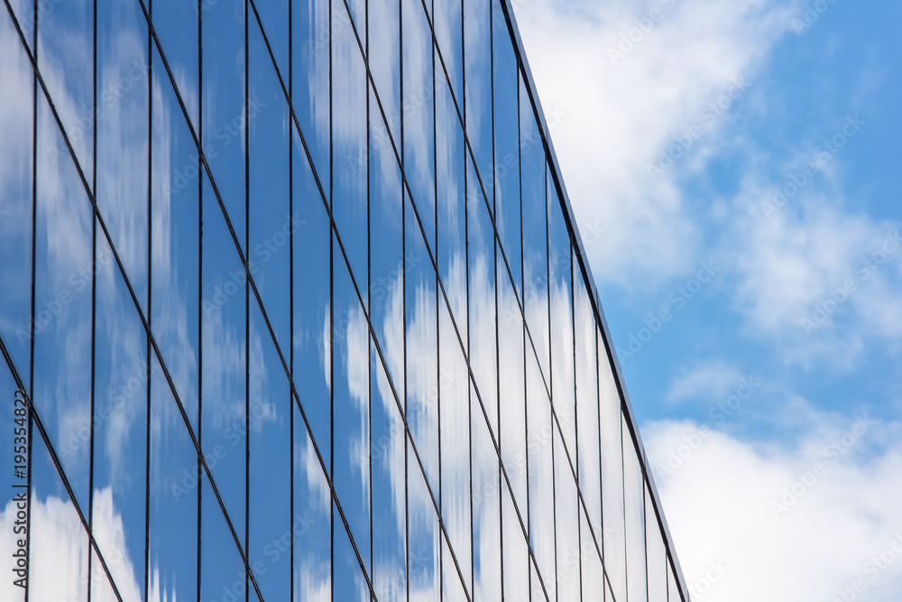 Reflection of the sky on the glass of a building