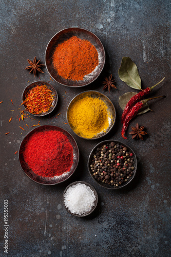 Colorful spices on stone table
