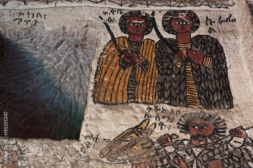 wall mural of saints and iconographic scenes  painted in naive african christian style  on church wall in Ethiopia 