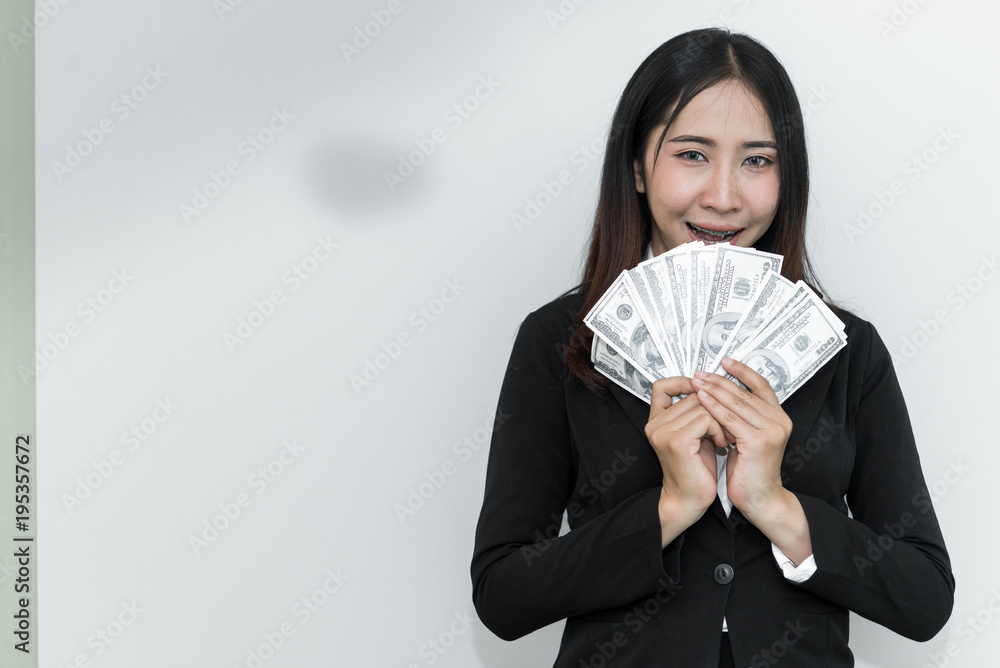 Happy business man with a lot of dollar money in hand on white background Happy business man with a lot of dollar money in hand on white background