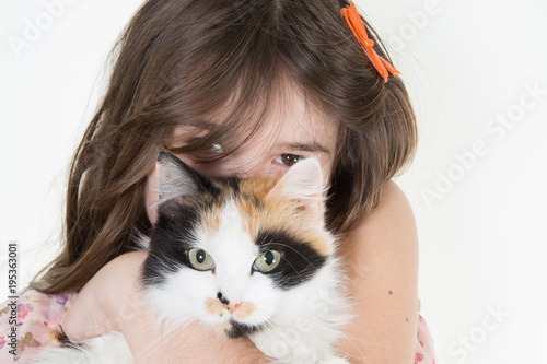 Beautiful young girl posing with a lovely young cat kitten