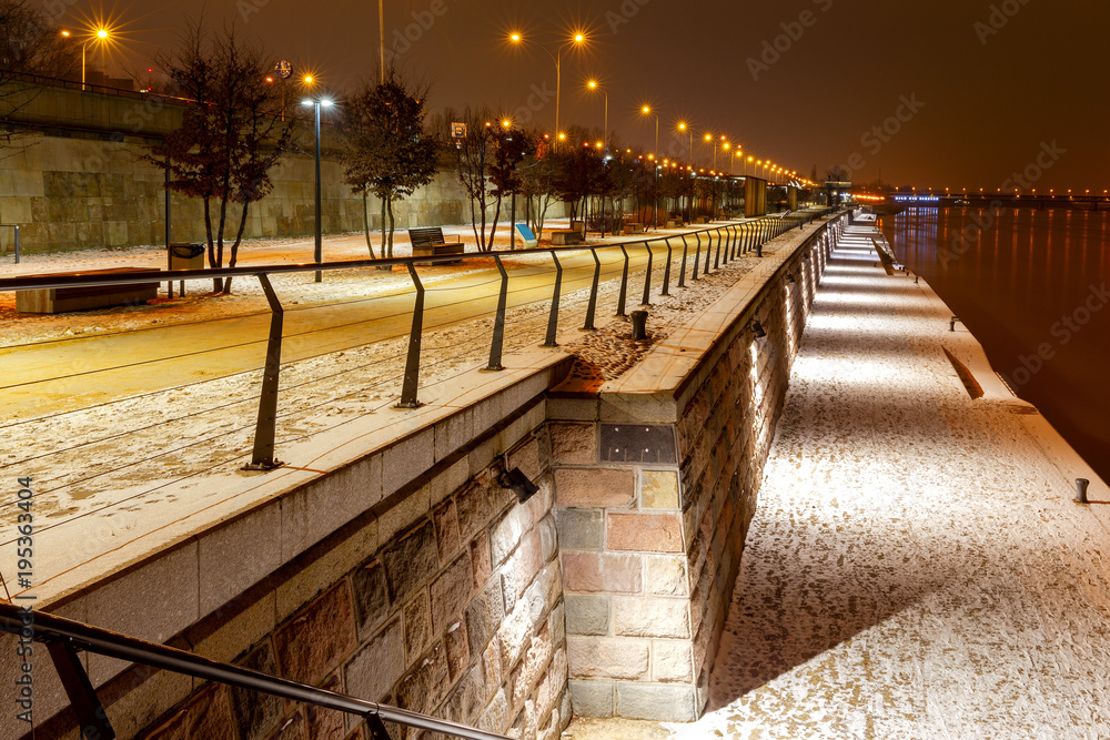 Warsaw. View of the city embankment at night.
