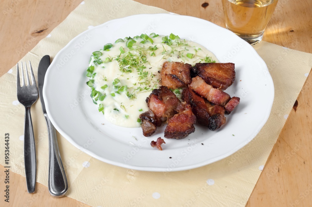 Baked pork pieces with mashed potato.