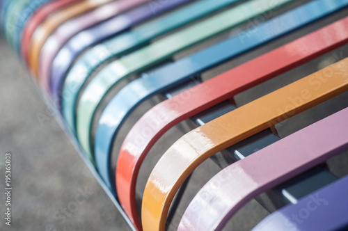 closeup of colorful metallic bench in the street