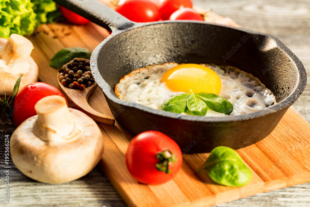 Fried eggs in a frying pan. Rustic breakfast Fried eggs in a frying pan. Rustic breakfast