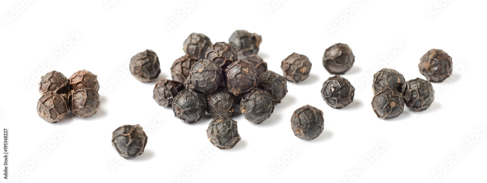 close up of dried black peppercorns isolated on white close up of dried black peppercorns isolated on white