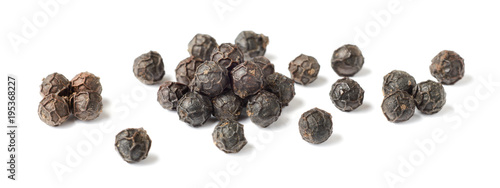 Vászonkép close up of dried black peppercorns isolated on white
