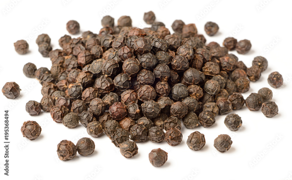 close up of dried black peppercorns isolated on white close up of dried black peppercorns isolated on white