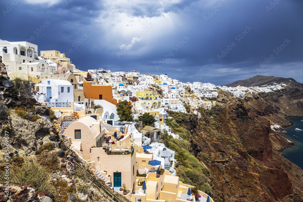 View of the city of Oia on the island of Santorini and the waters of the Aegean Sea in Greece