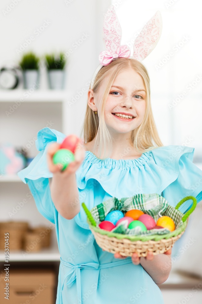 Teenage girl holding Easter eggs Teenage girl holding Easter eggs