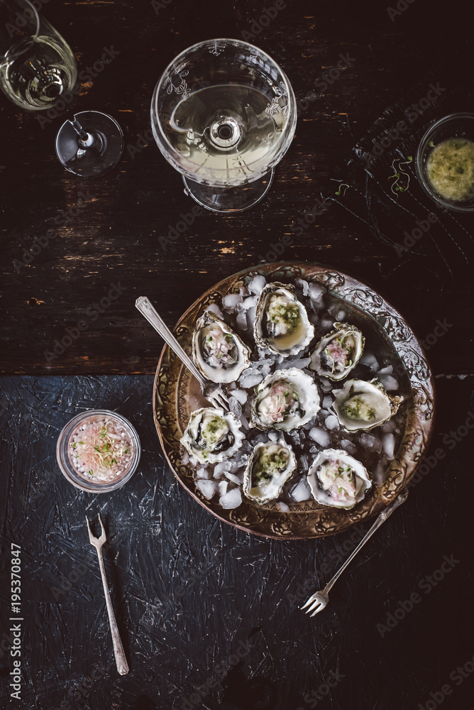 Oysters with serrano cilantro mignonette sauce and glass of wine Oysters with serrano cilantro mignonette sauce and glass of wine
