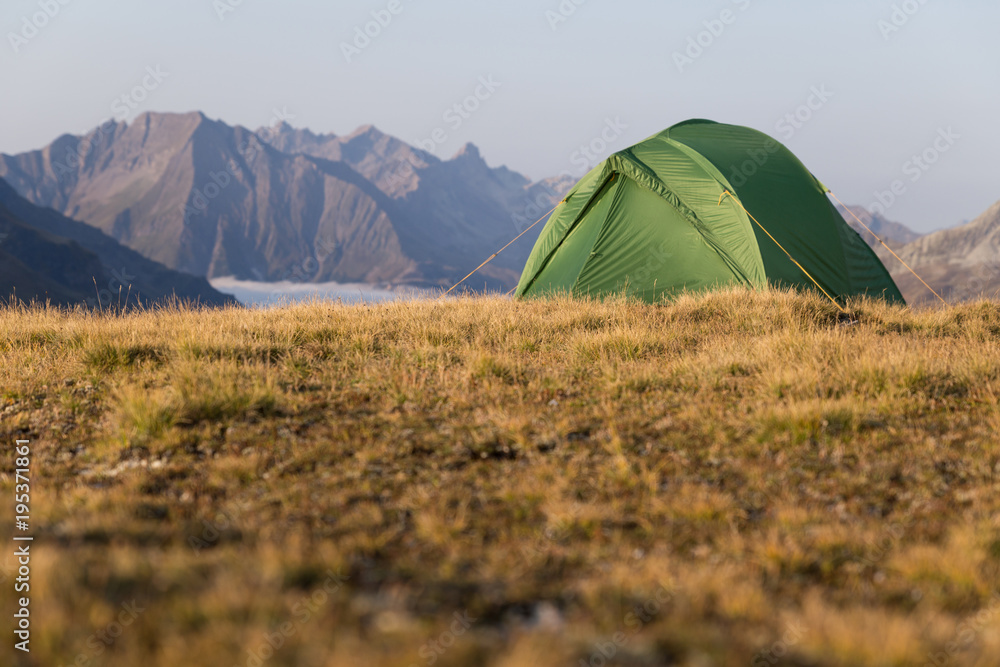campaign in mountains with a tent
