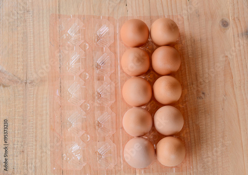 Eggs on wooden background.