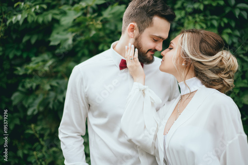 bride and groom walking in a beautiful garden. trees, Park photo