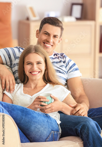 Young couple on sofa at home