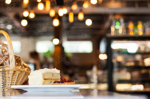 Wallpaper Mural Slice of Vanilla Cake with Icing on a Plate in a Cafe Torontodigital.ca