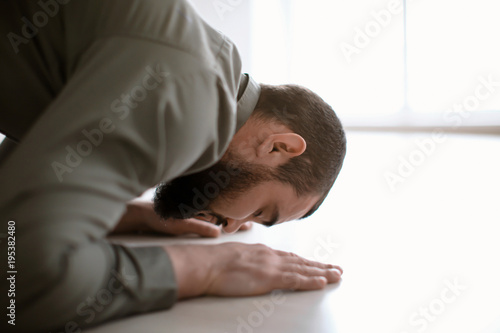 Young Muslim man praying, i...