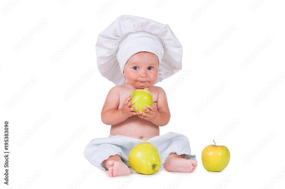 Cheerful little child with apples in hands in a chef suit on a white background. Cheerful little child with apples in hands in a chef suit on a white background.