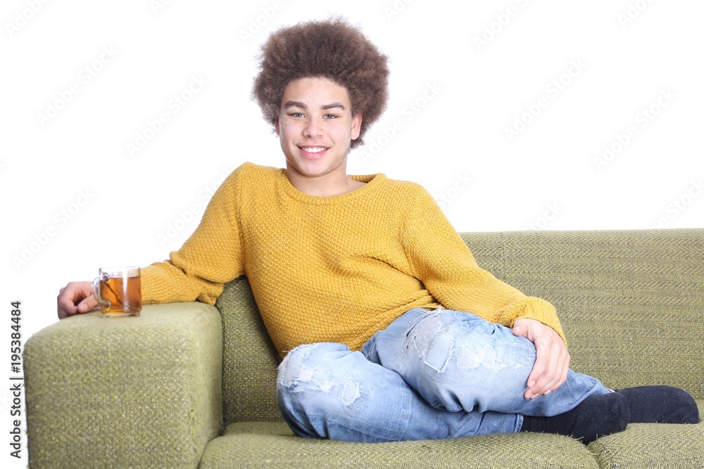 Fototapeta premium Young afro man on the couch